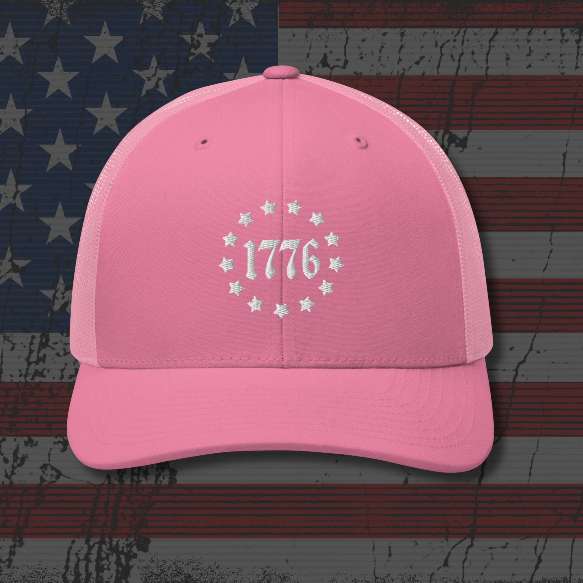 Pink cap with '1776' design on an American flag background