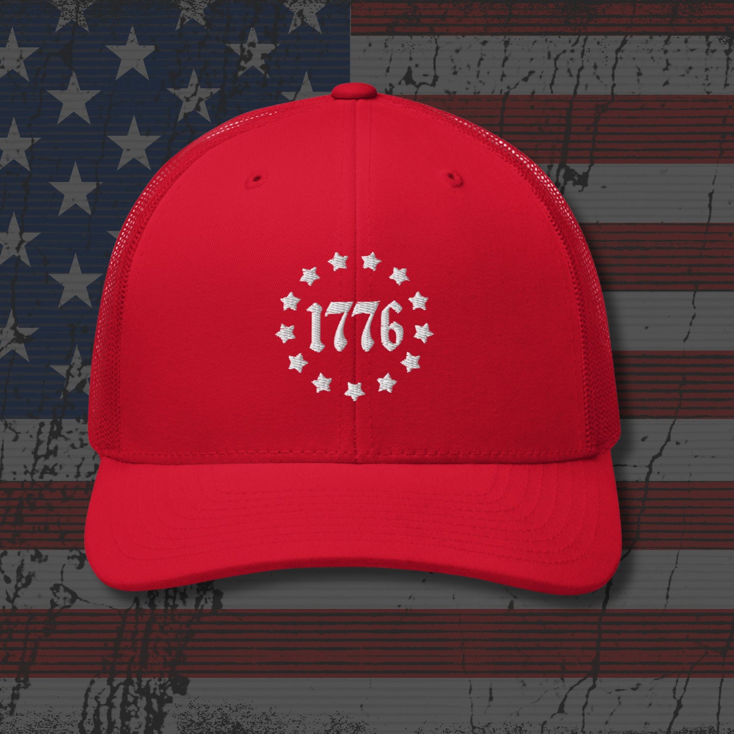 Red cap with '1776' design on a distressed American flag background