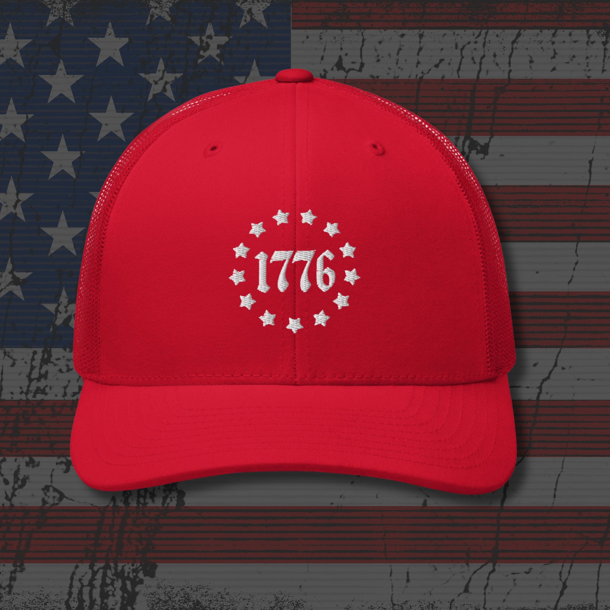 Red cap with '1776' design on a distressed American flag background