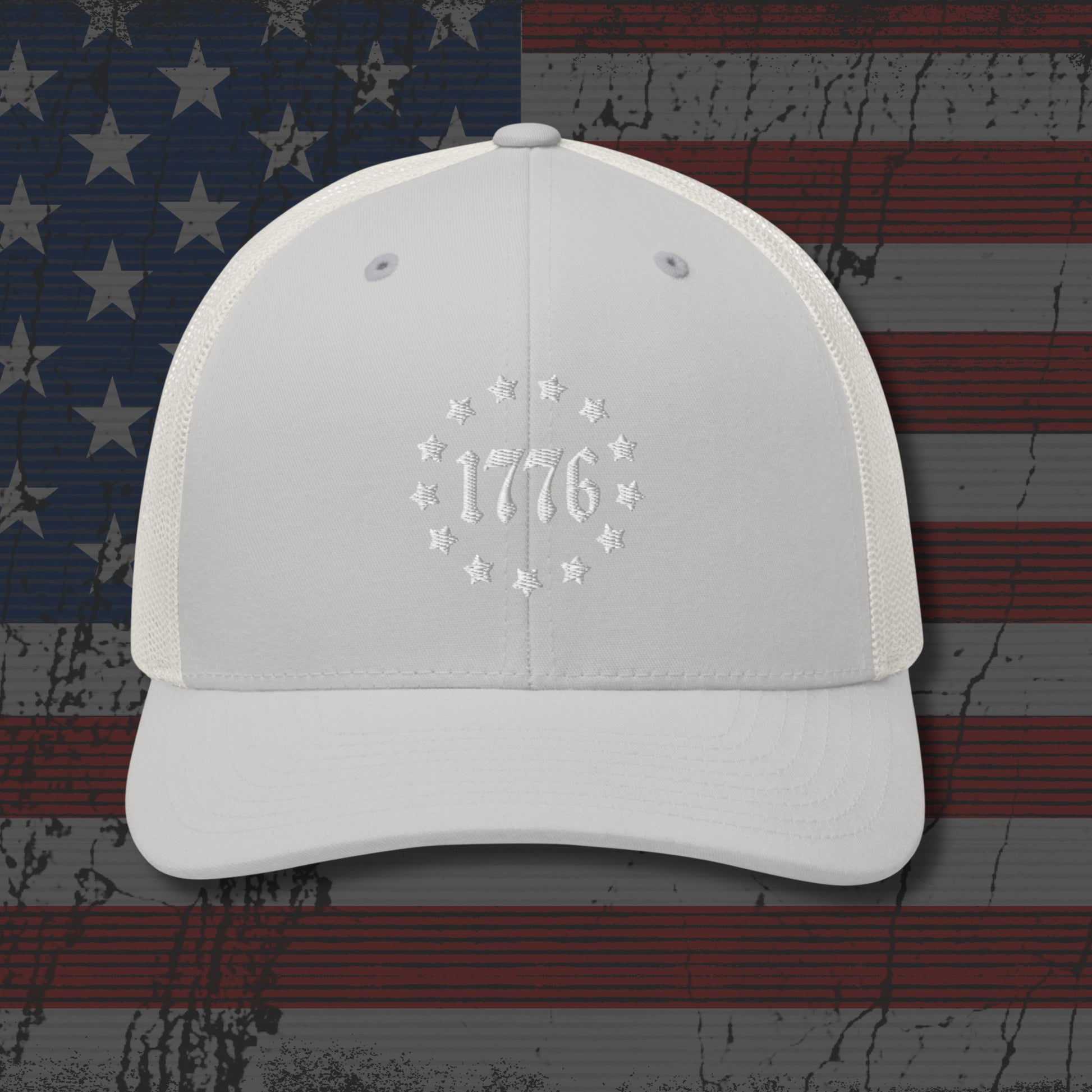 White cap with '1776' design on an American flag background