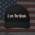 Black trucker hat with embroidered I Am the People, back view