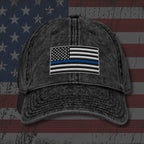 Black distressed cap with American flag patch on an American flag background