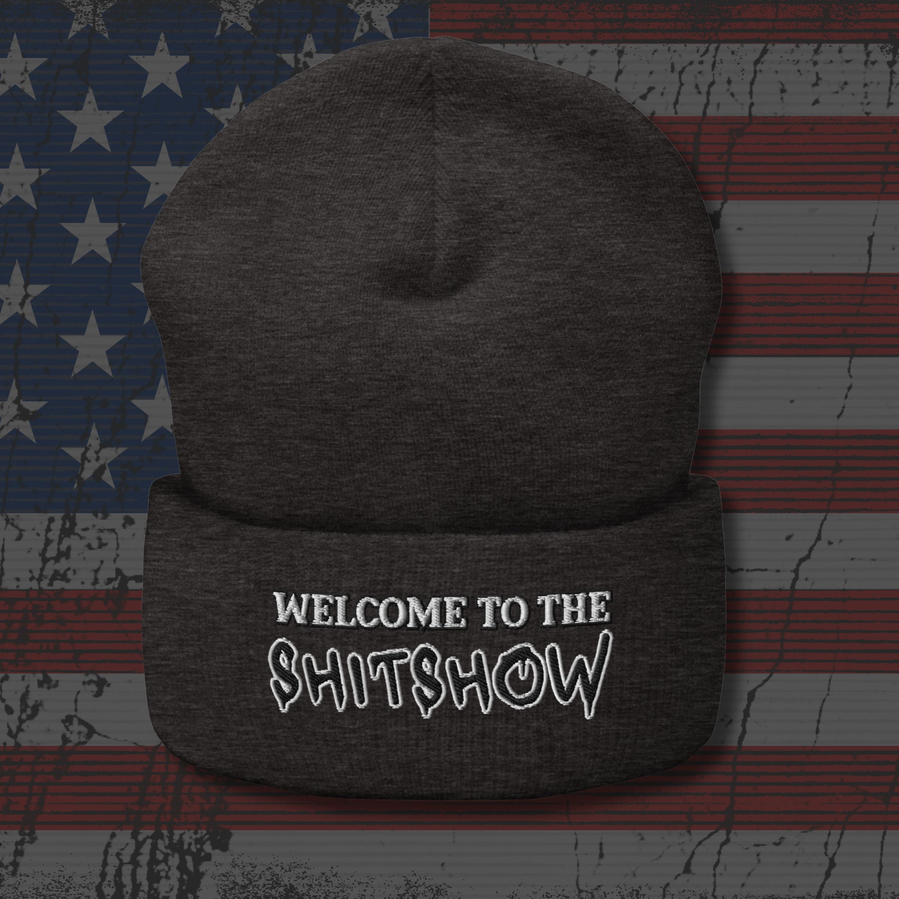 Dark gray beanie with 'Welcome to the Shitshow' text on an American flag background