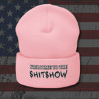 Pink beanie with 'Welcome to the Shitshow' text on an American flag background