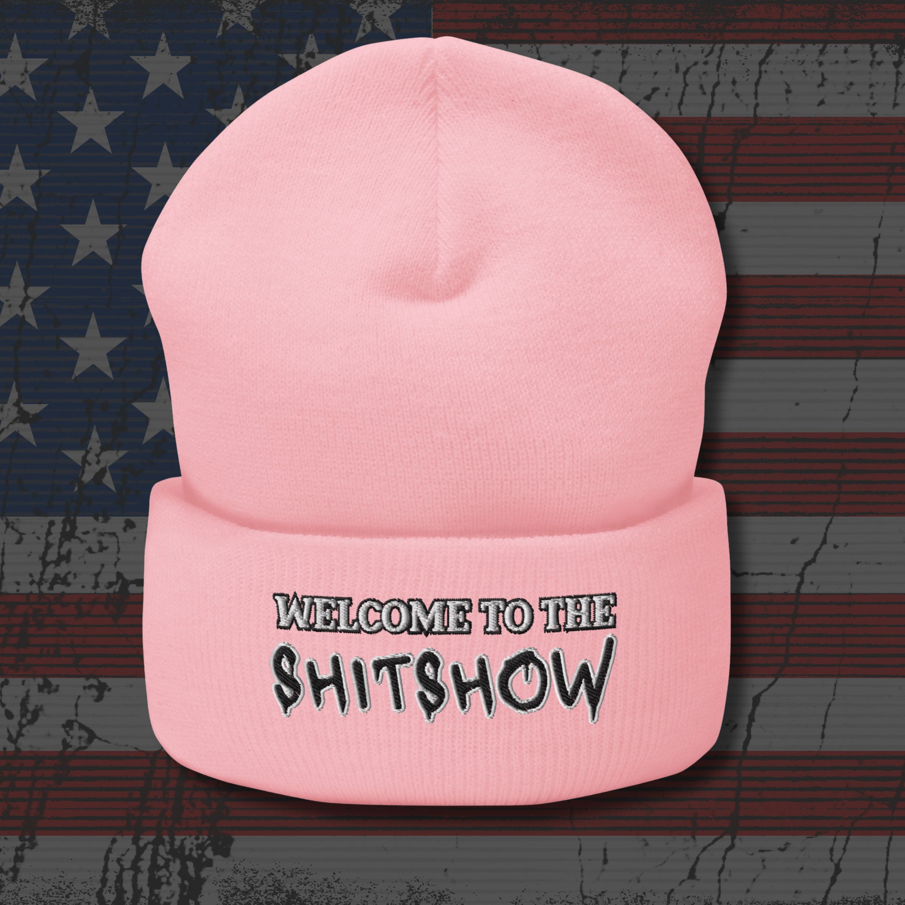 Pink beanie with 'Welcome to the Shitshow' text on an American flag background