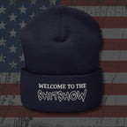 Navy blue beanie with 'Welcome to the Shitshow' text on an American flag background