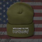 Green beanie with 'Welcome to the Shitshow' text on an American flag background