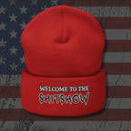 Red beanie with 'Welcome to the Shitshow' text on a distressed American flag background