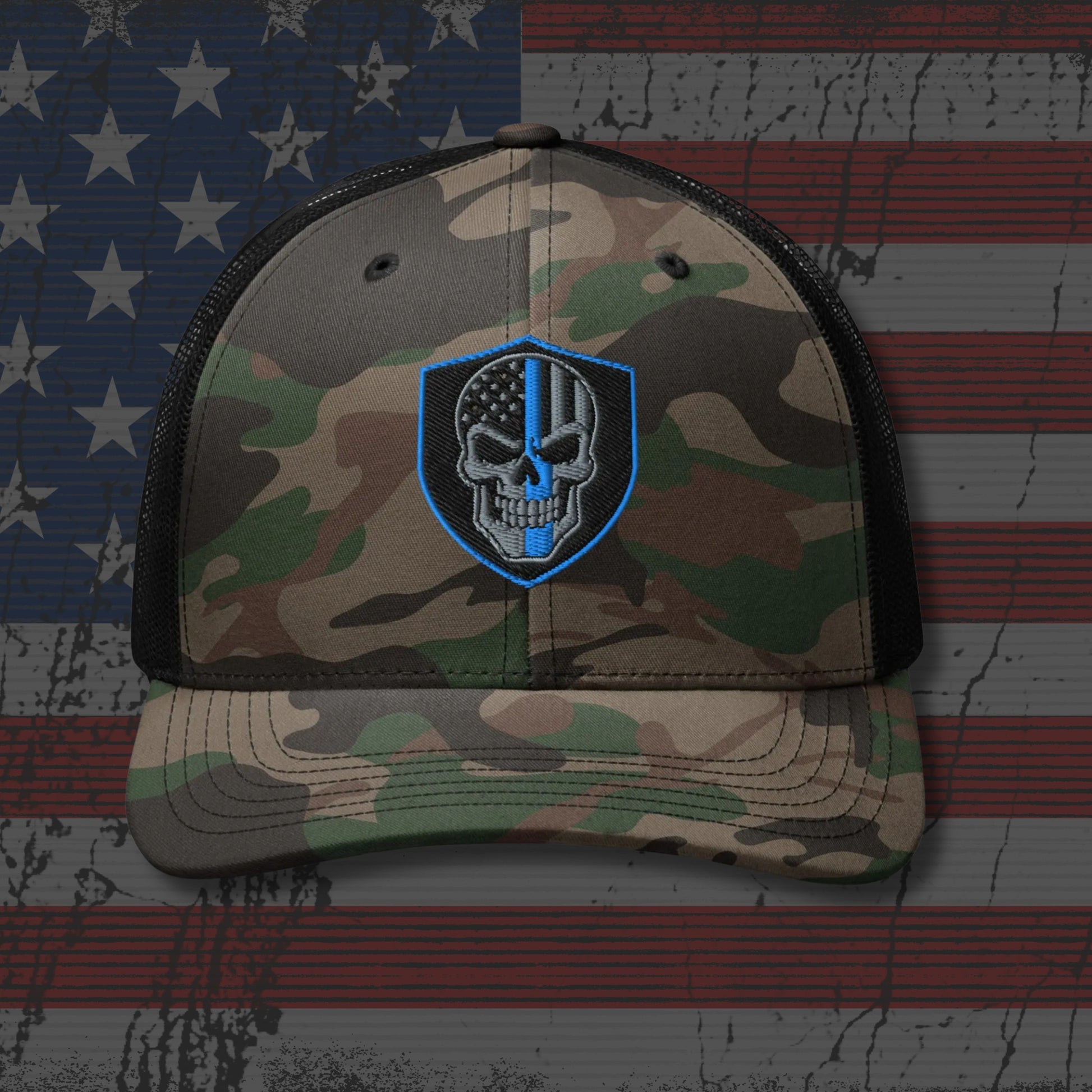 Camouflage cap with skull and American flag design on an American flag background