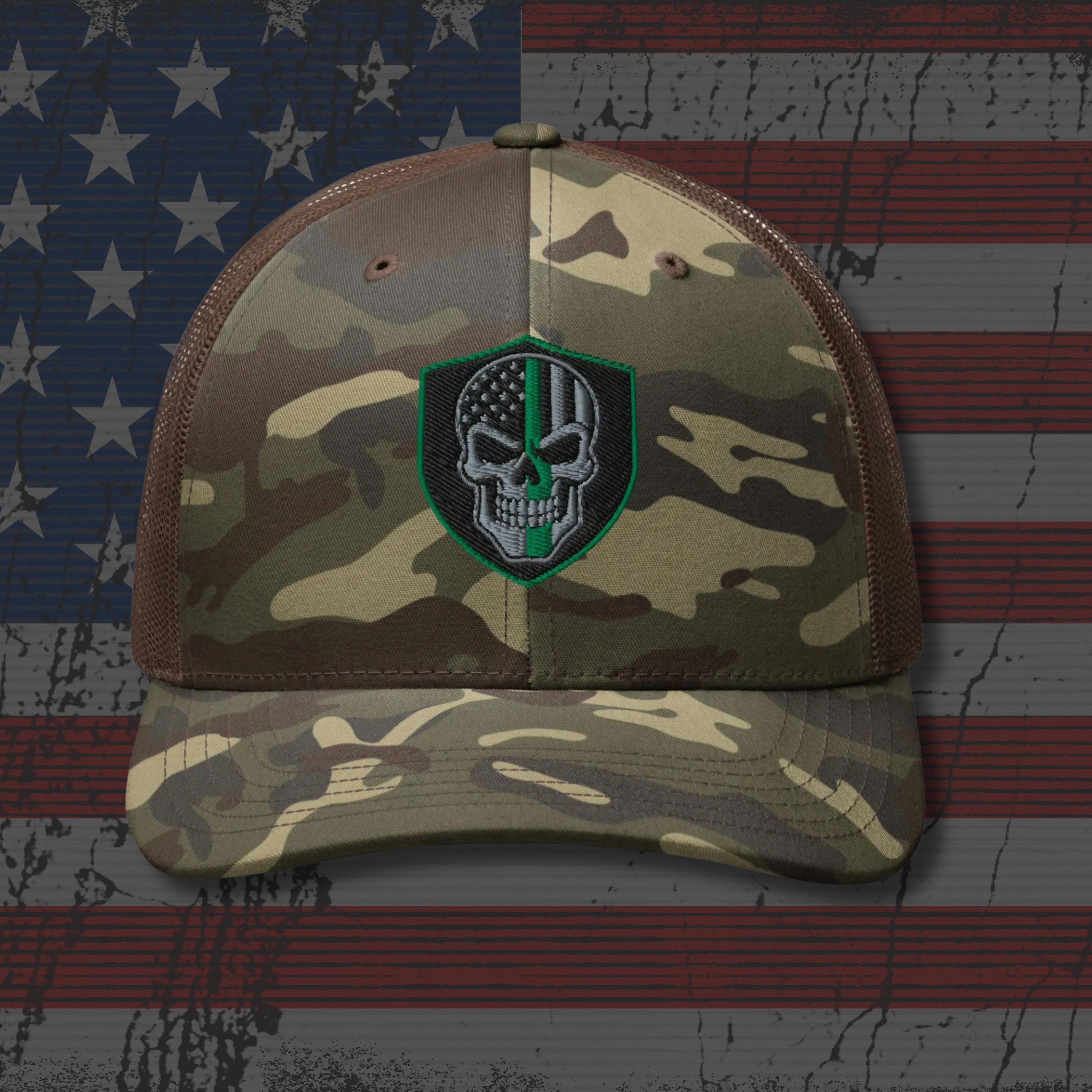 Camouflage baseball cap with a skull emblem on an American flag background