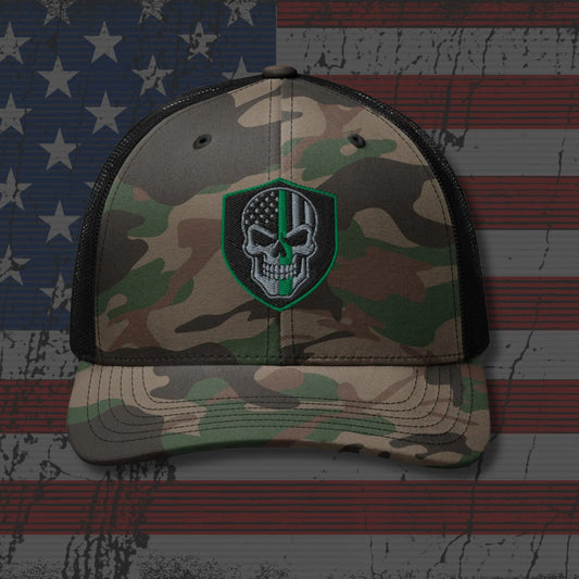 Camouflage cap with a skull and crossbones patch on an American flag background