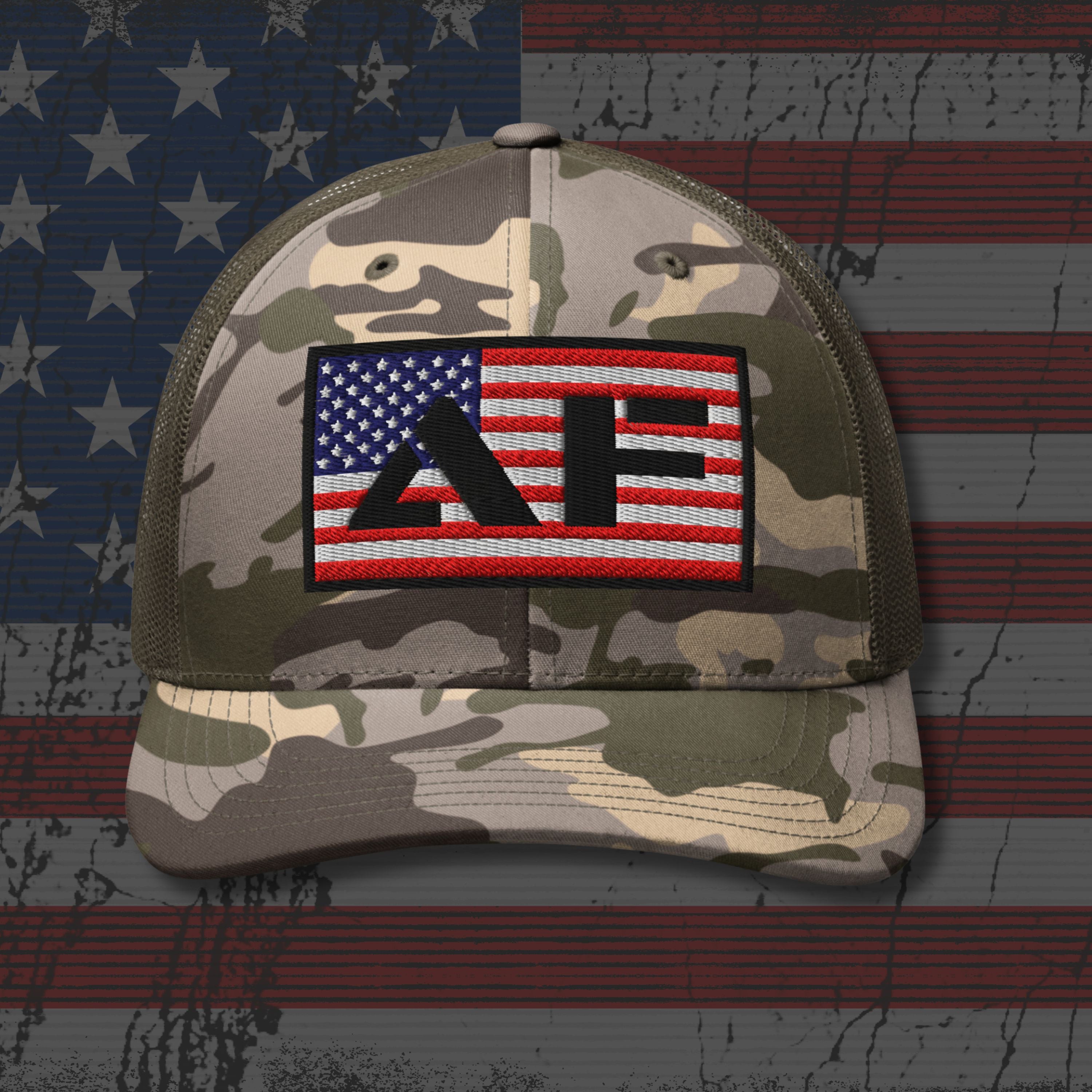 Camouflage cap with a patch featuring the American flag and text on an American flag background