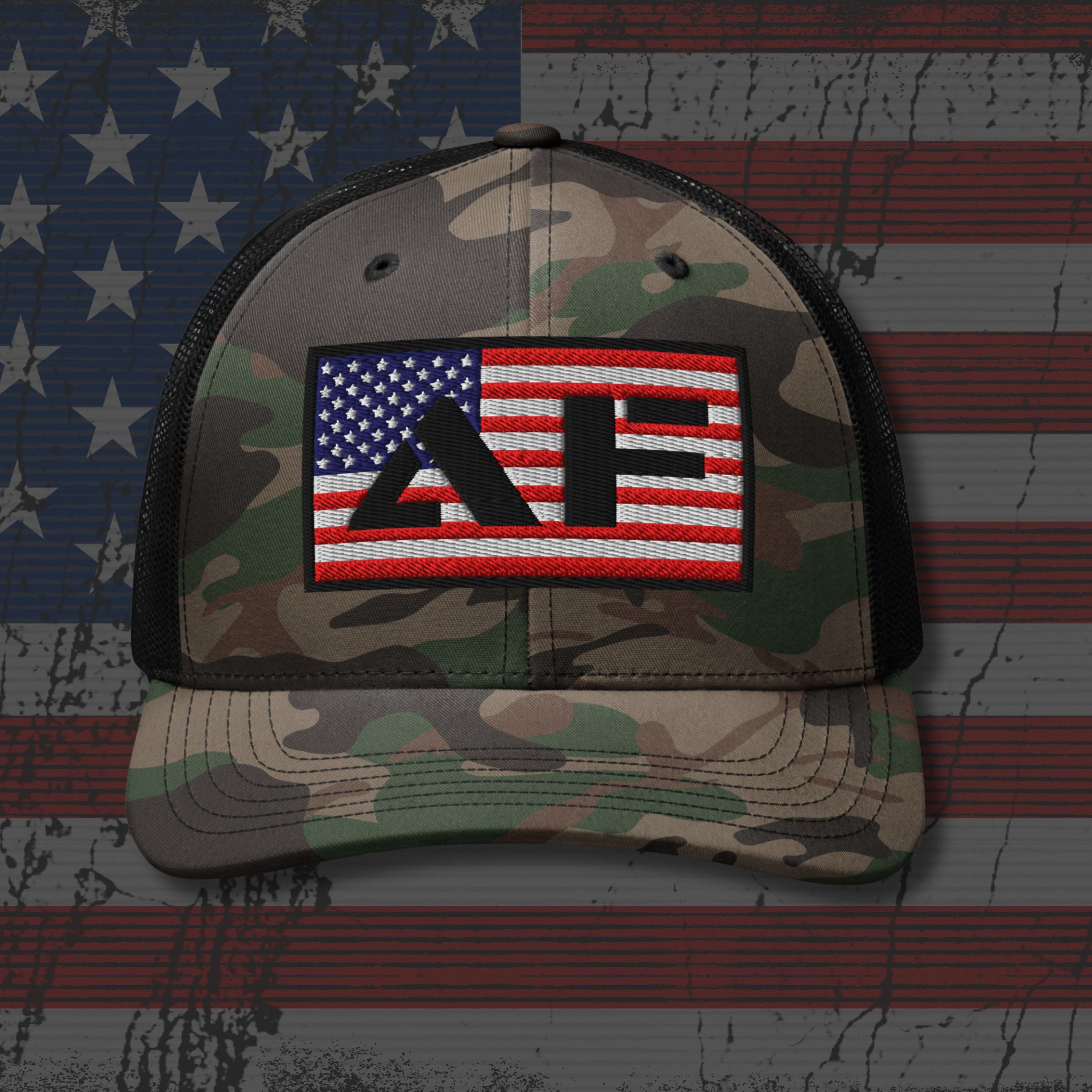 Camouflage cap with American flag and 'AF' patch on a distressed American flag background