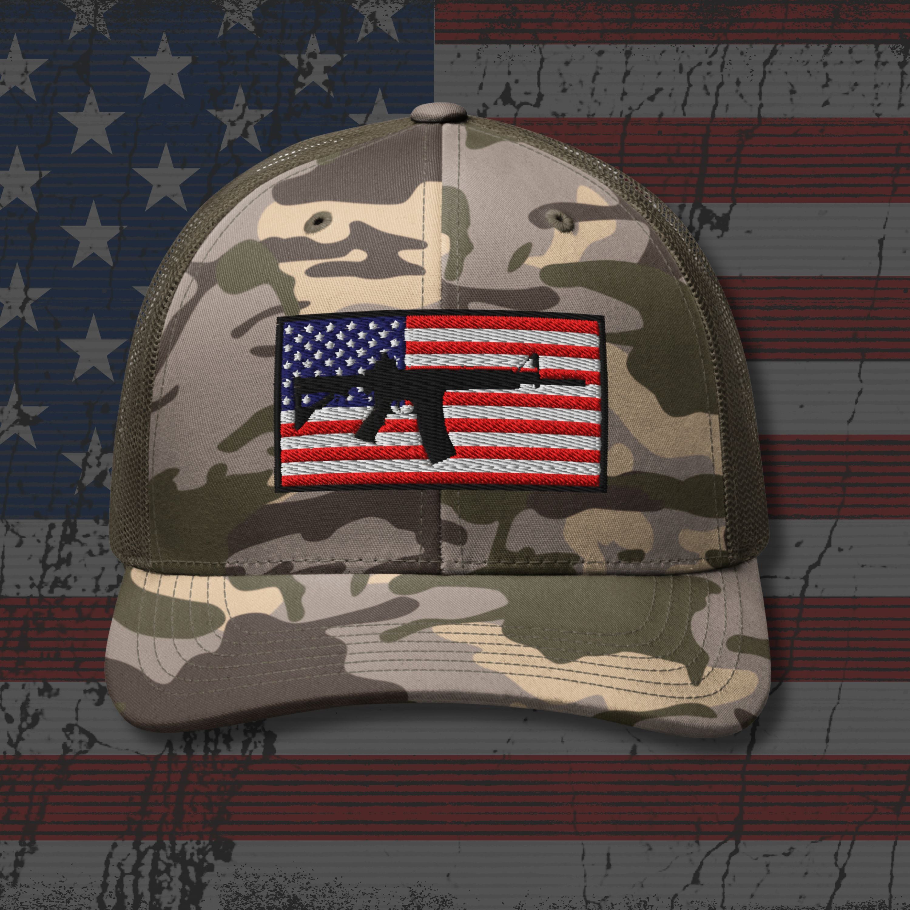 Camouflage cap with American flag patch on an American flag background