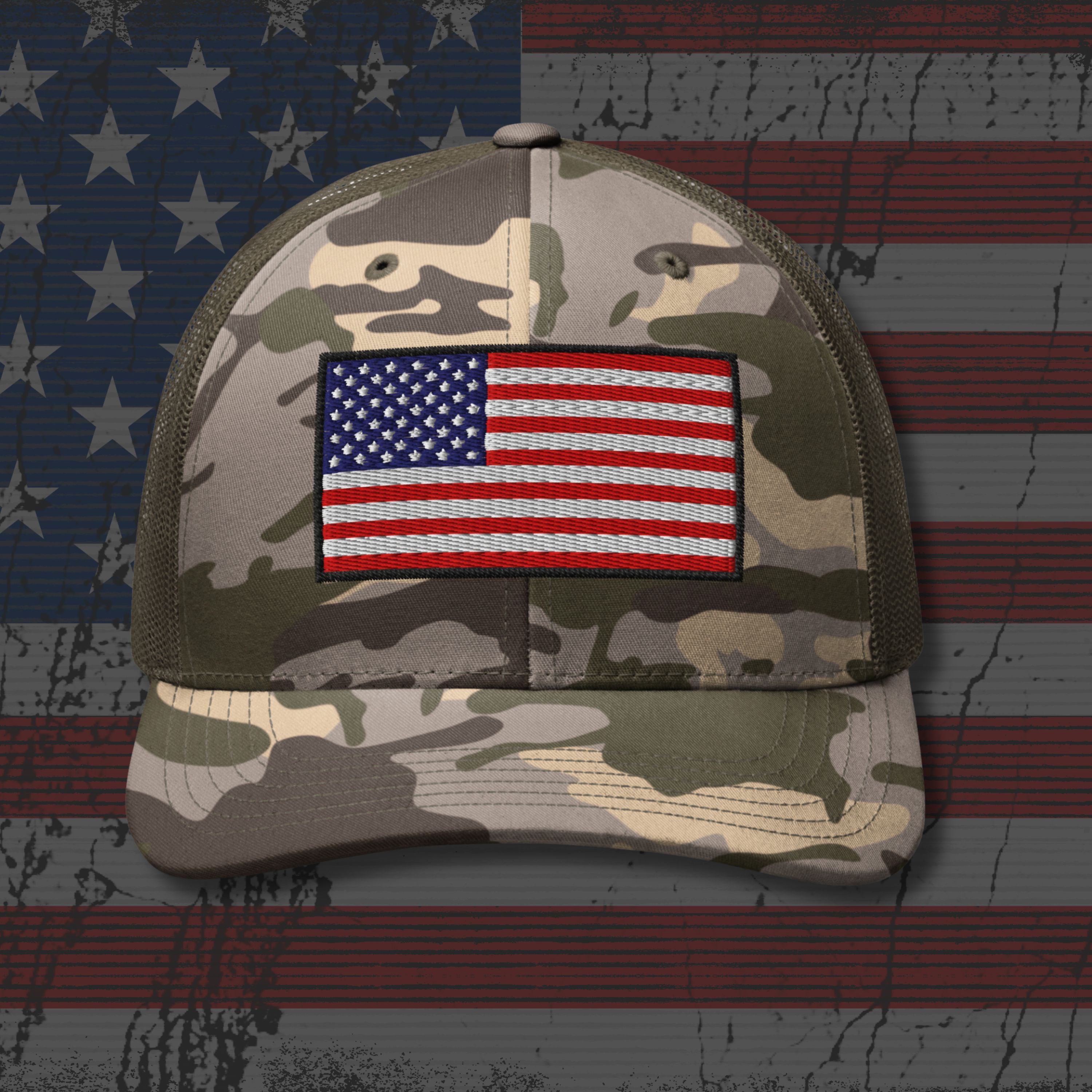 Camouflage cap with American flag patch on an American flag background