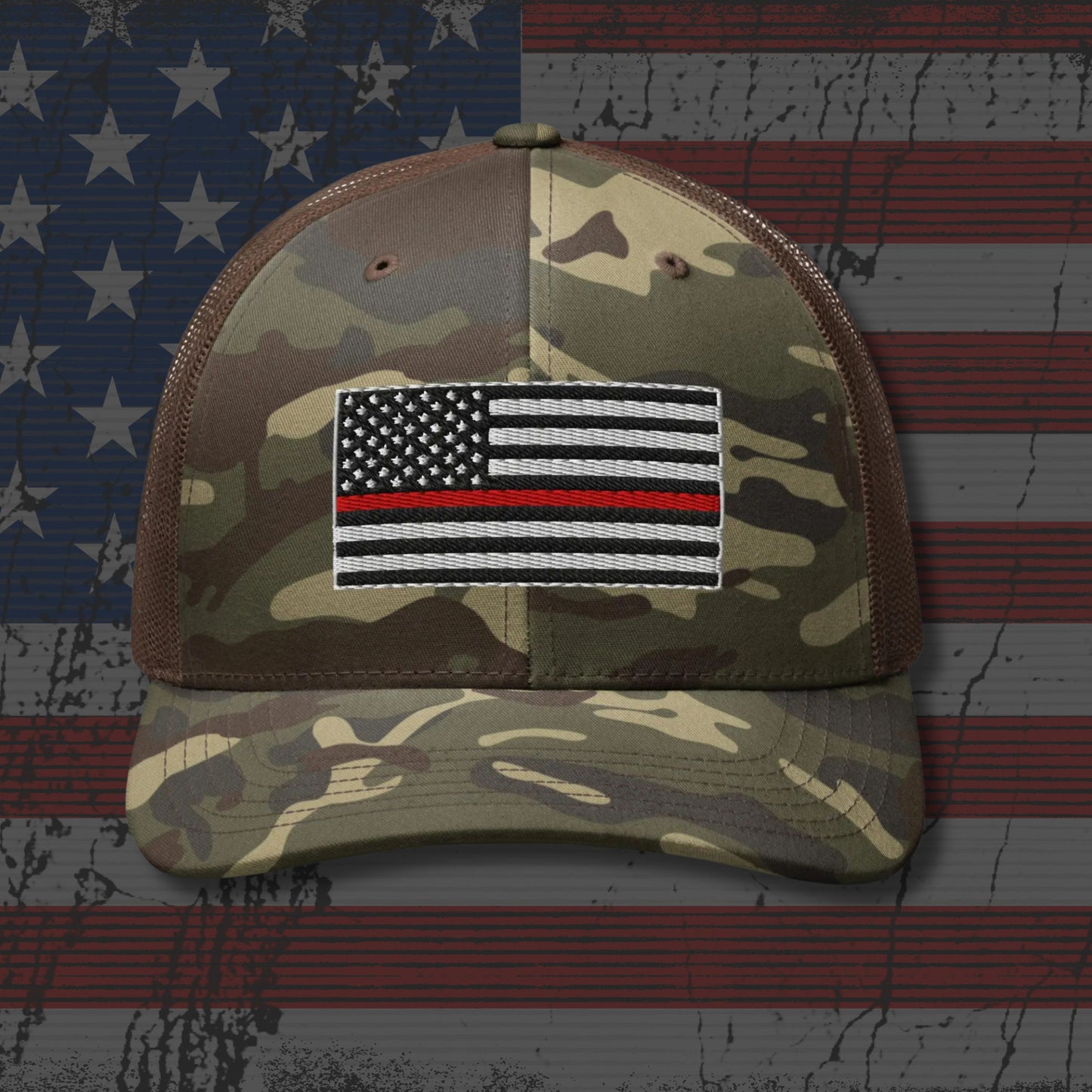Camouflage cap with a Thin Red Line flag patch on an American flag background
