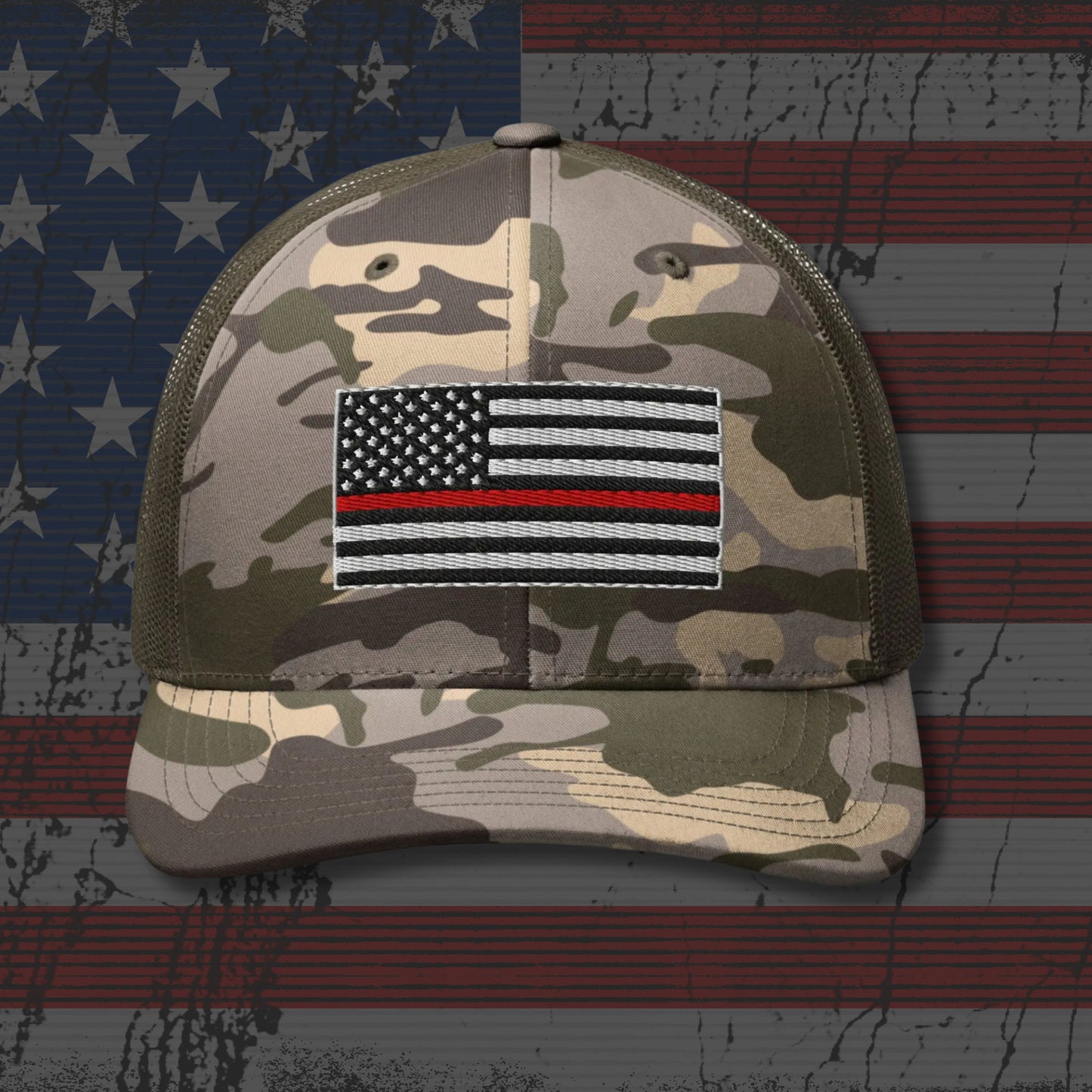 Camouflage cap with a flag patch on an American flag background
