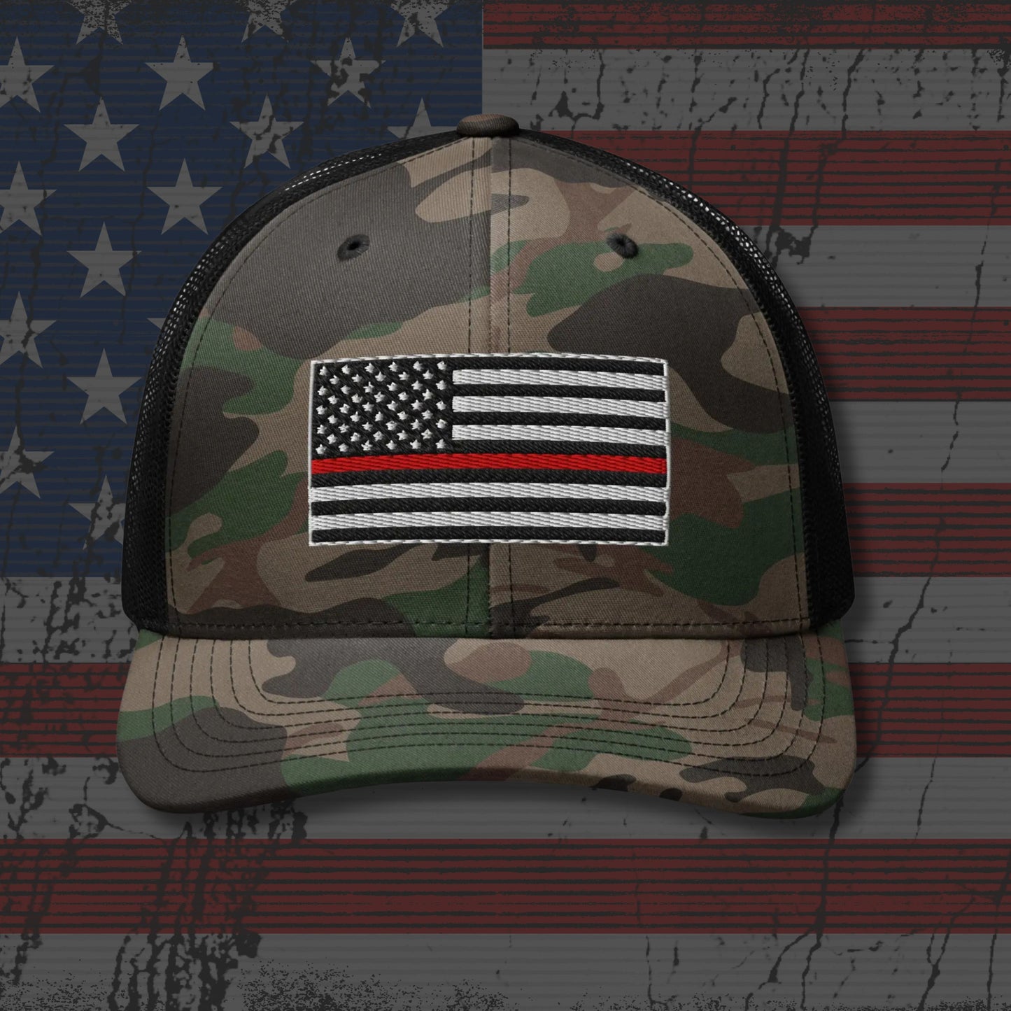 Camouflage cap with a Thin Red Line flag patch on an American flag background