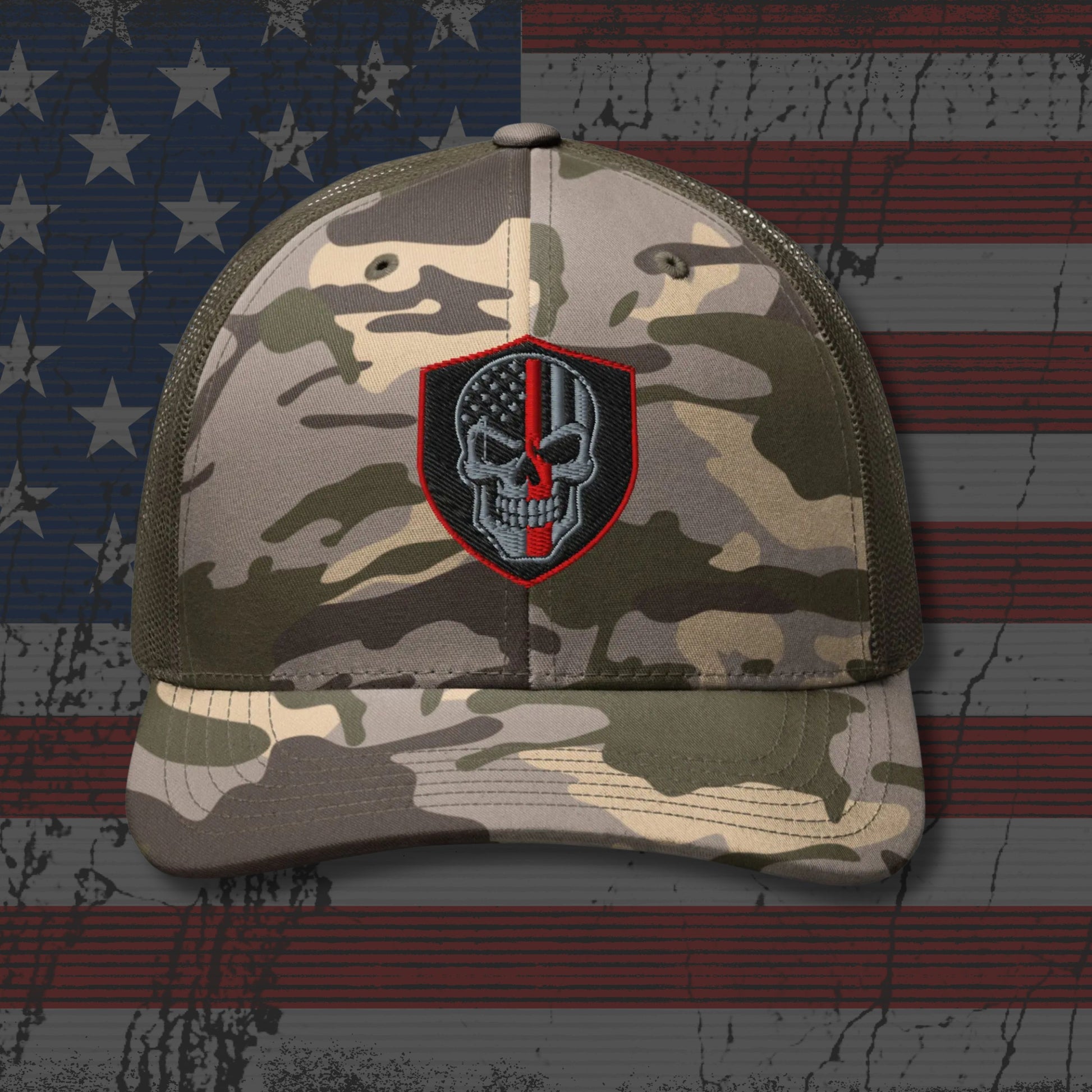 Camouflage cap with a skull and American flag patch on an American flag background