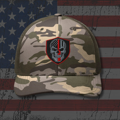 Camouflage cap with a skull and American flag patch on an American flag background