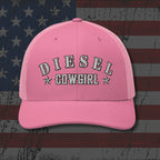 Pink cap with 'DIESEL COWGIRL' text on a distressed American flag background