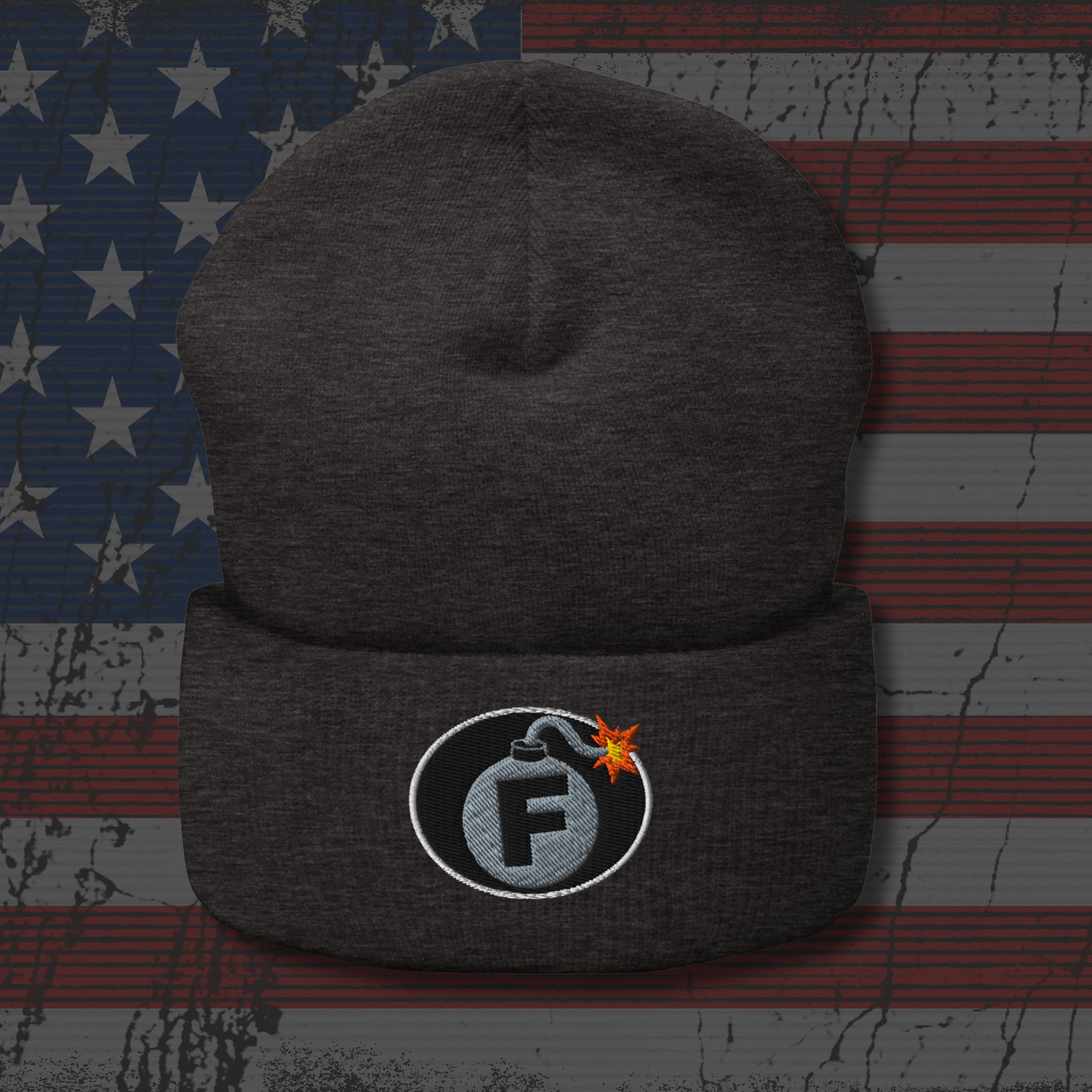 Dark gray beanie with a logo on an American flag background