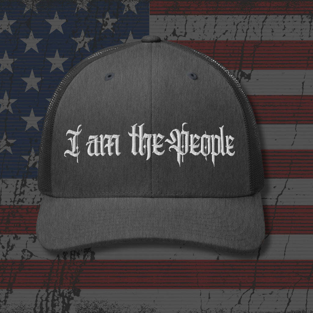 Gray cap with 'I am the People' text on an American flag background