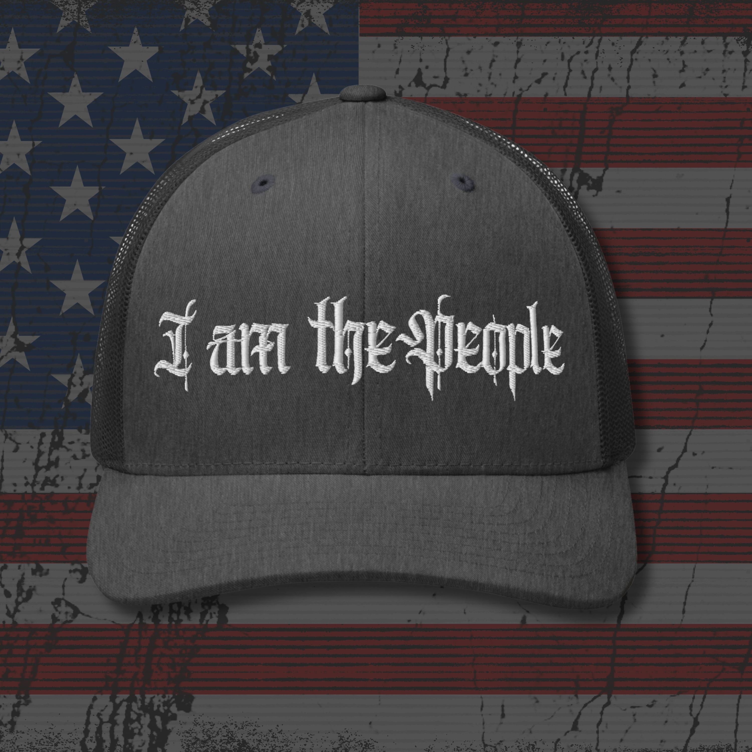 Gray cap with 'I am the People' text on an American flag background