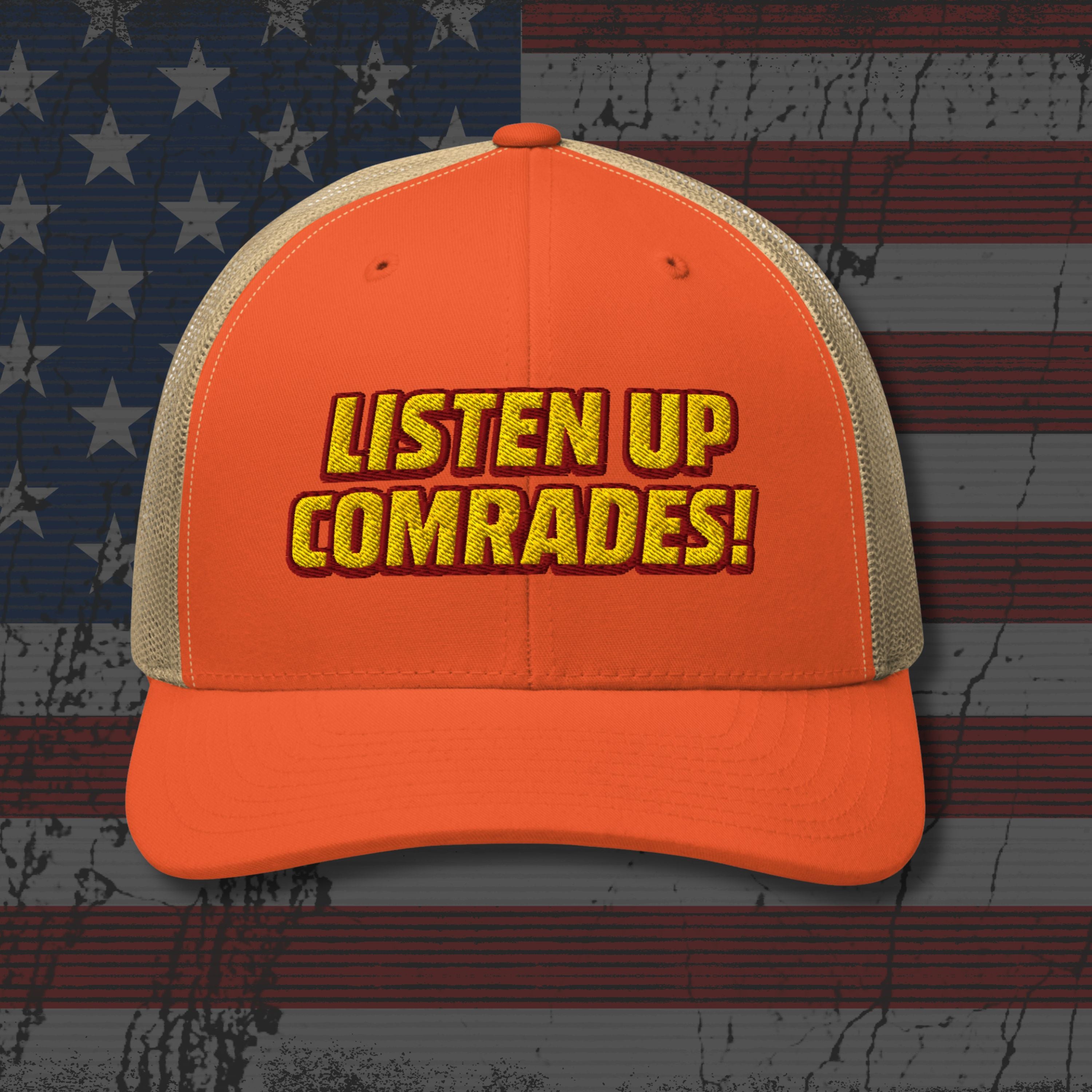 Orange cap with 'Listen Up Comrades!' text on an American flag background