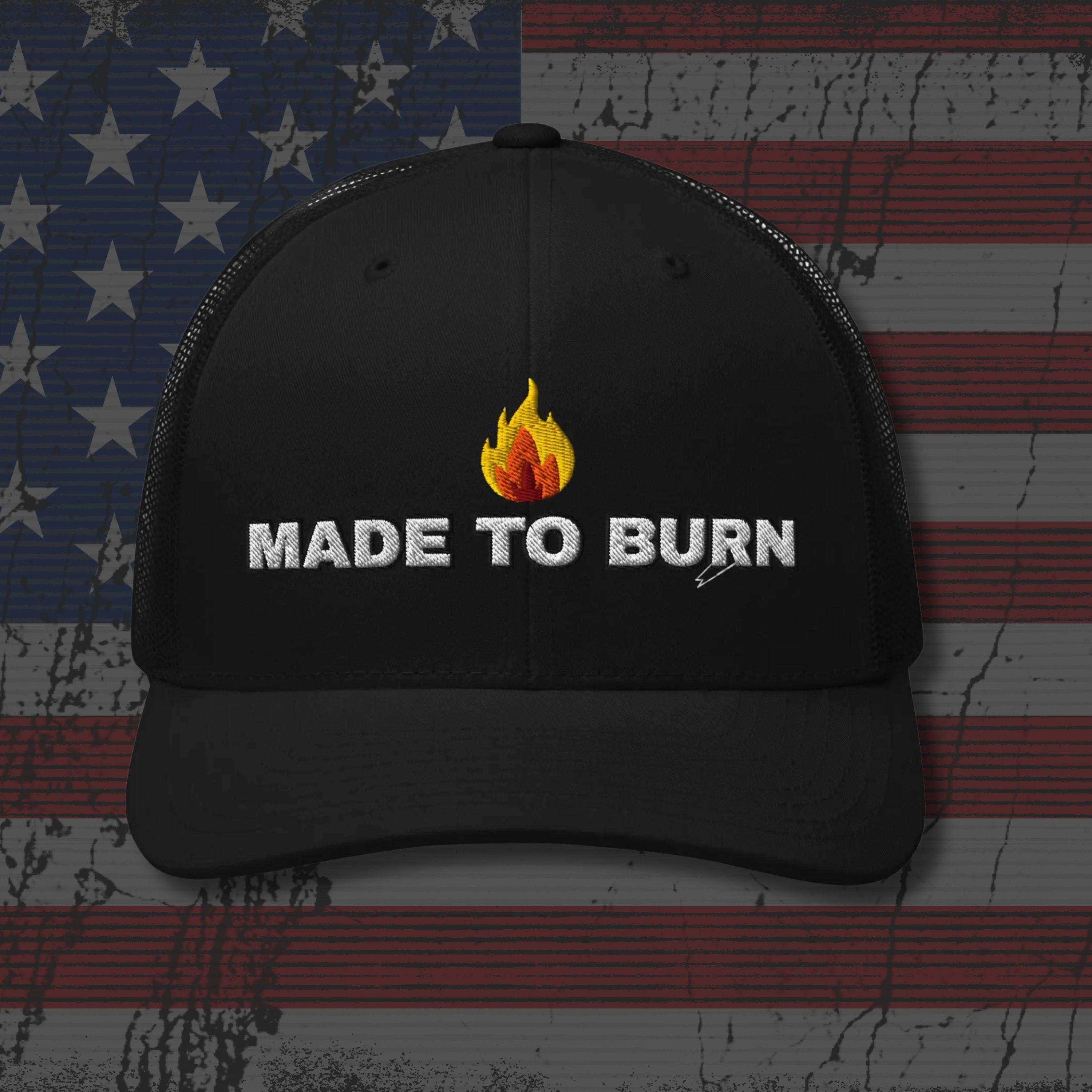 Black cap with 'Made to Burn' text and flame graphic on an American flag background