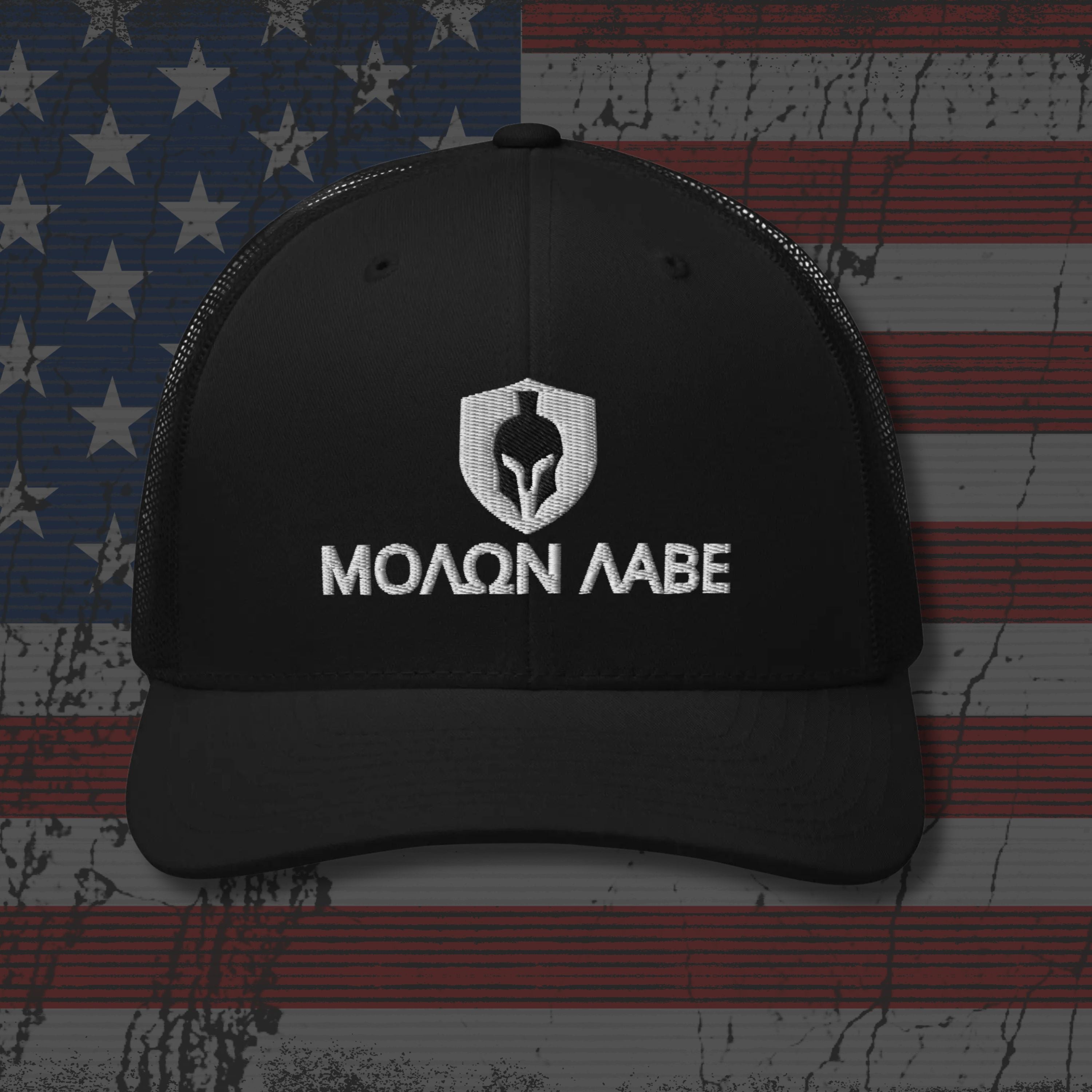 Black cap with 'Molon Labe' logo on an American flag background