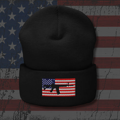 Black beanie with American flag and gun design on a distressed American flag background