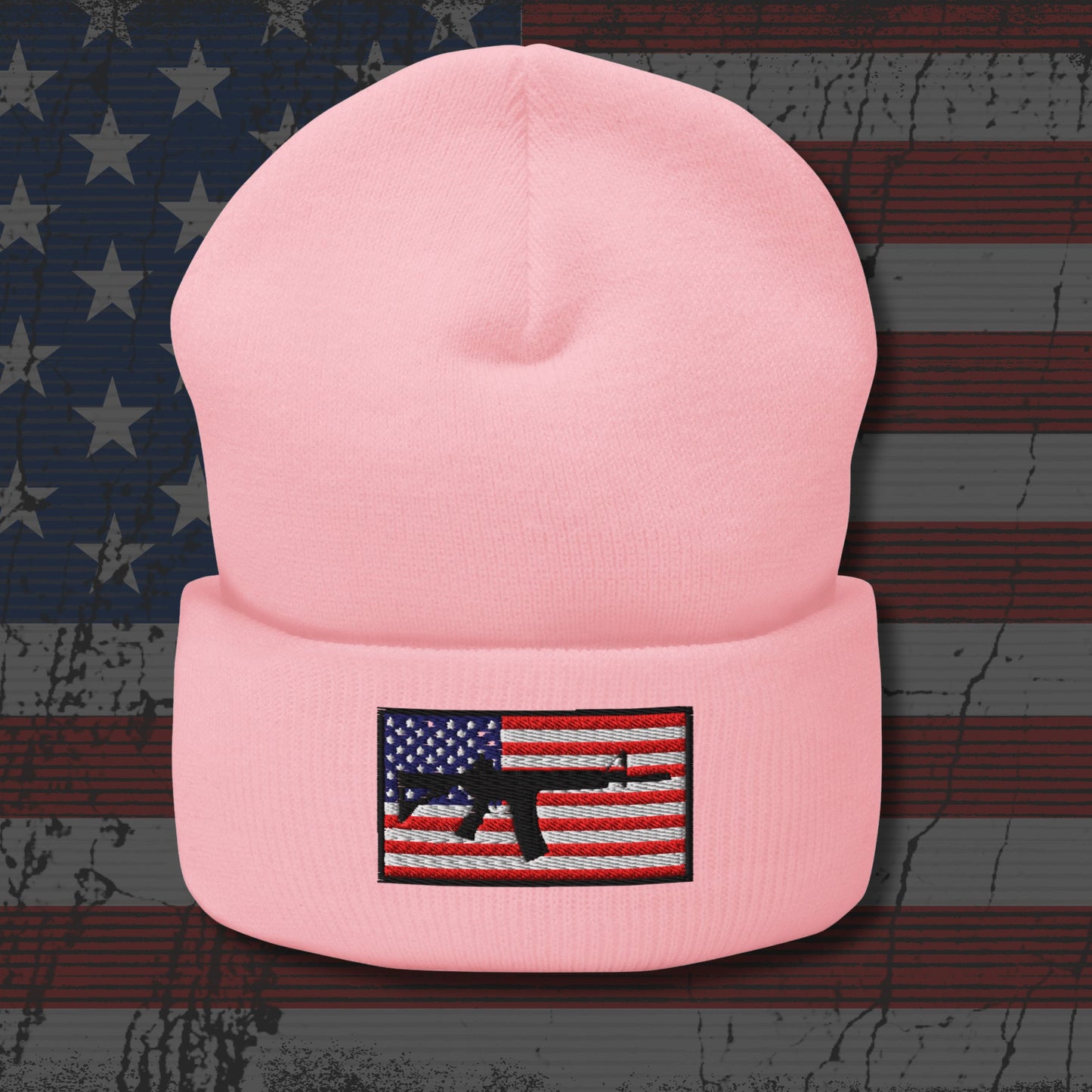 Pink beanie with American flag patch on a distressed American flag background