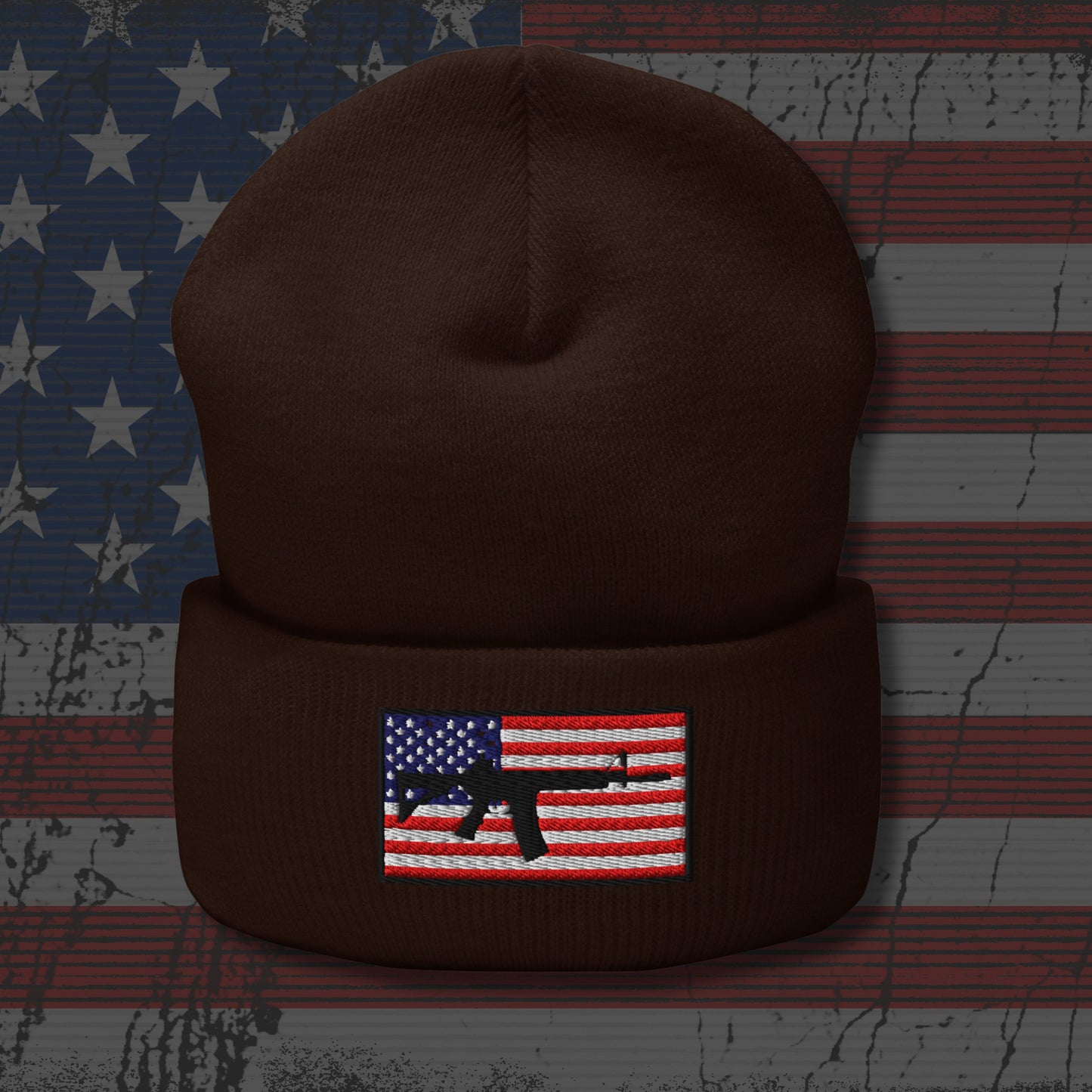Brown beanie with a flag and gun design on an American flag background
