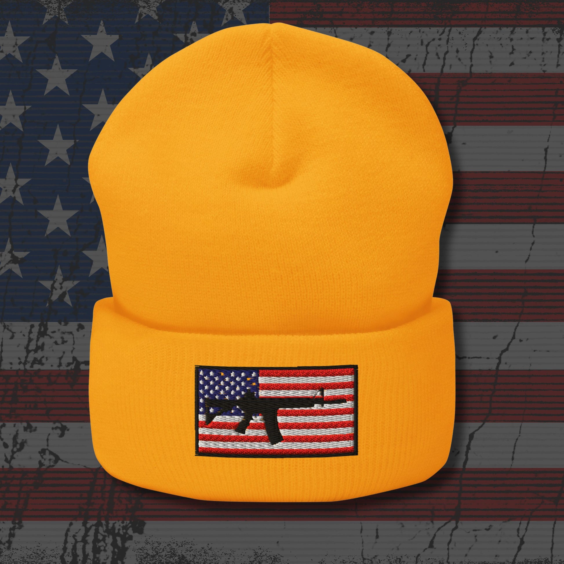Yellow beanie with American flag patch on a distressed American flag background