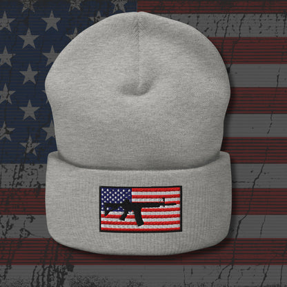 Gray beanie with American flag and gun patch on a distressed American flag background