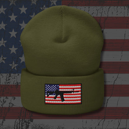 Green beanie with American flag and gun patch on a distressed American flag background
