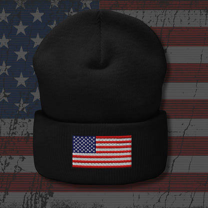 Black beanie with American flag patch on a textured American flag background
