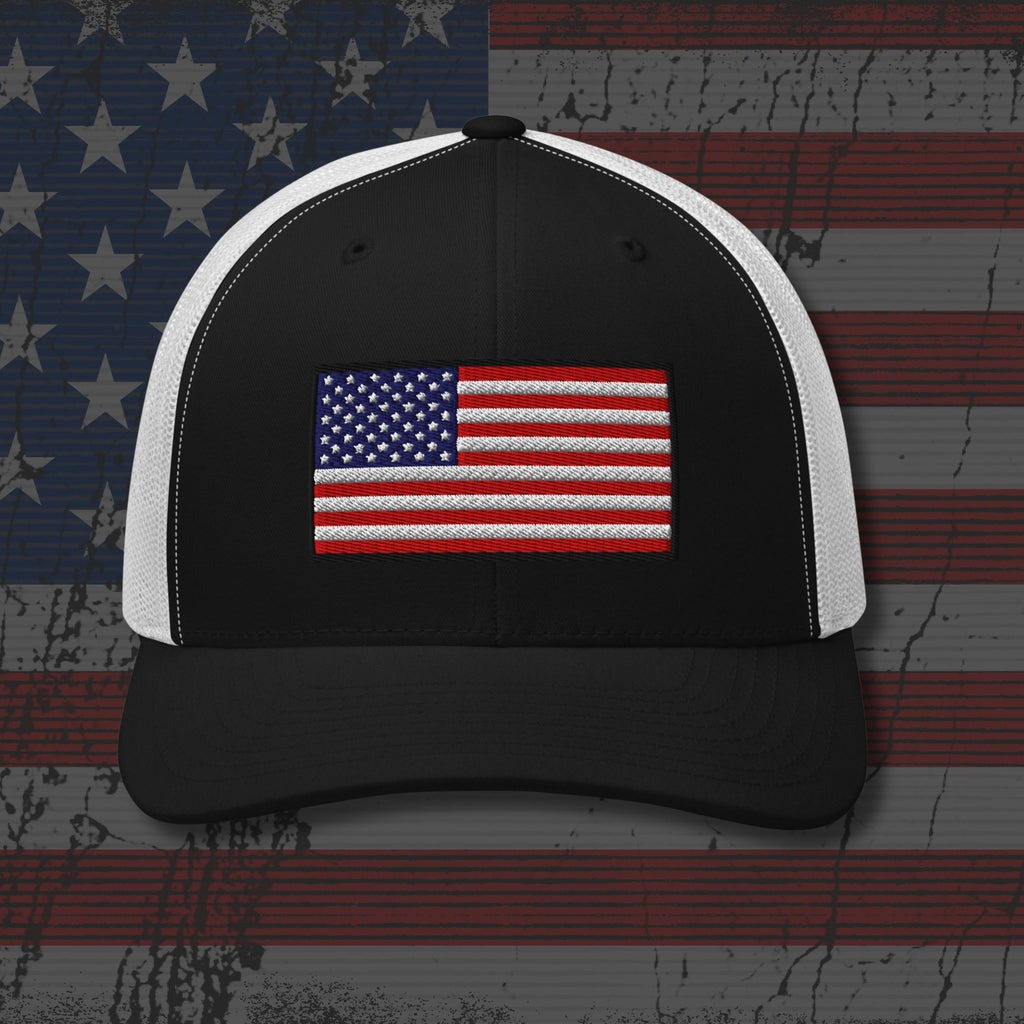 Black and white cap with American flag design on a distressed American flag background