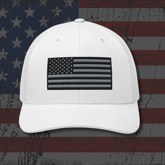 White cap with American flag patch on a distressed American flag background