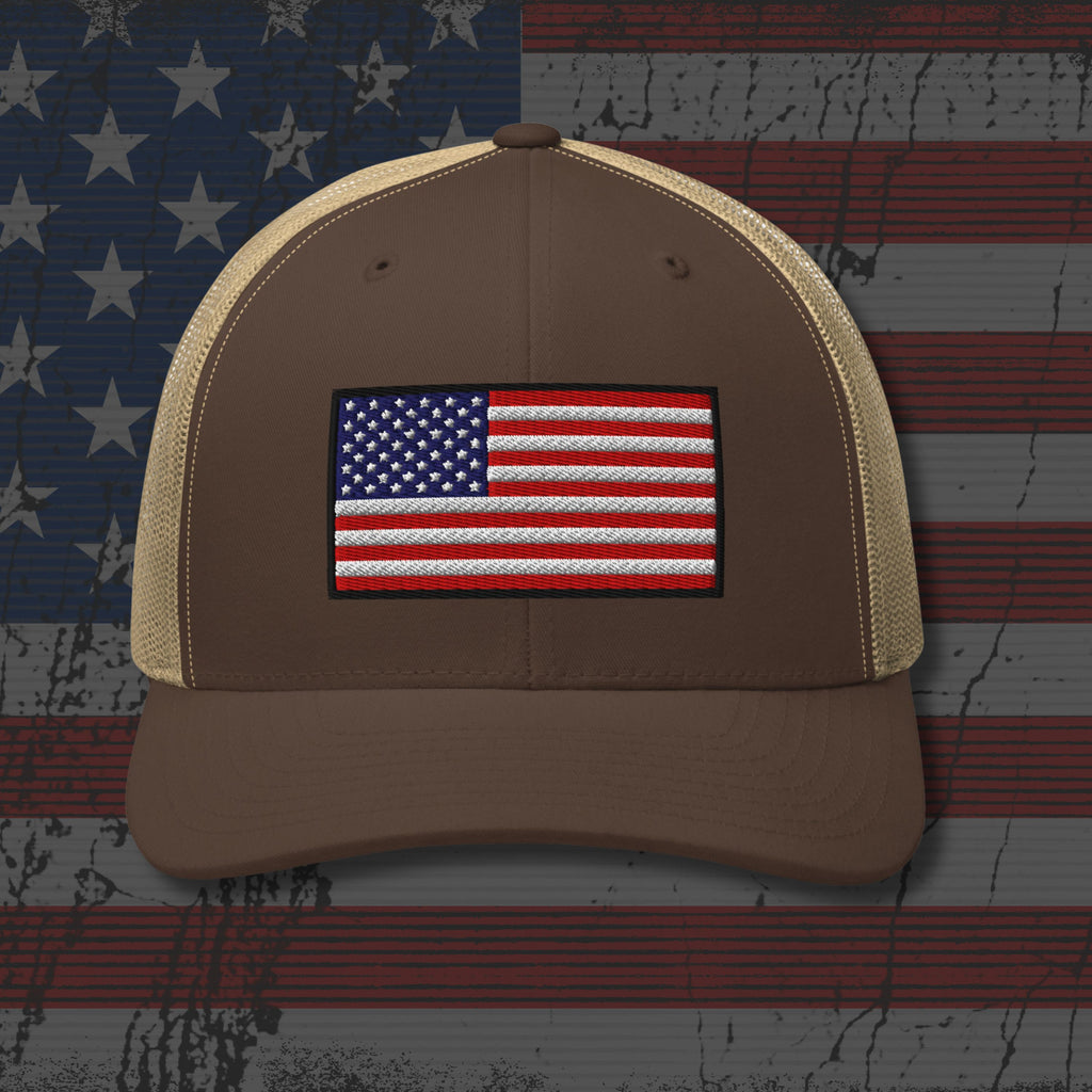 Brown cap with American flag patch on a distressed American flag background