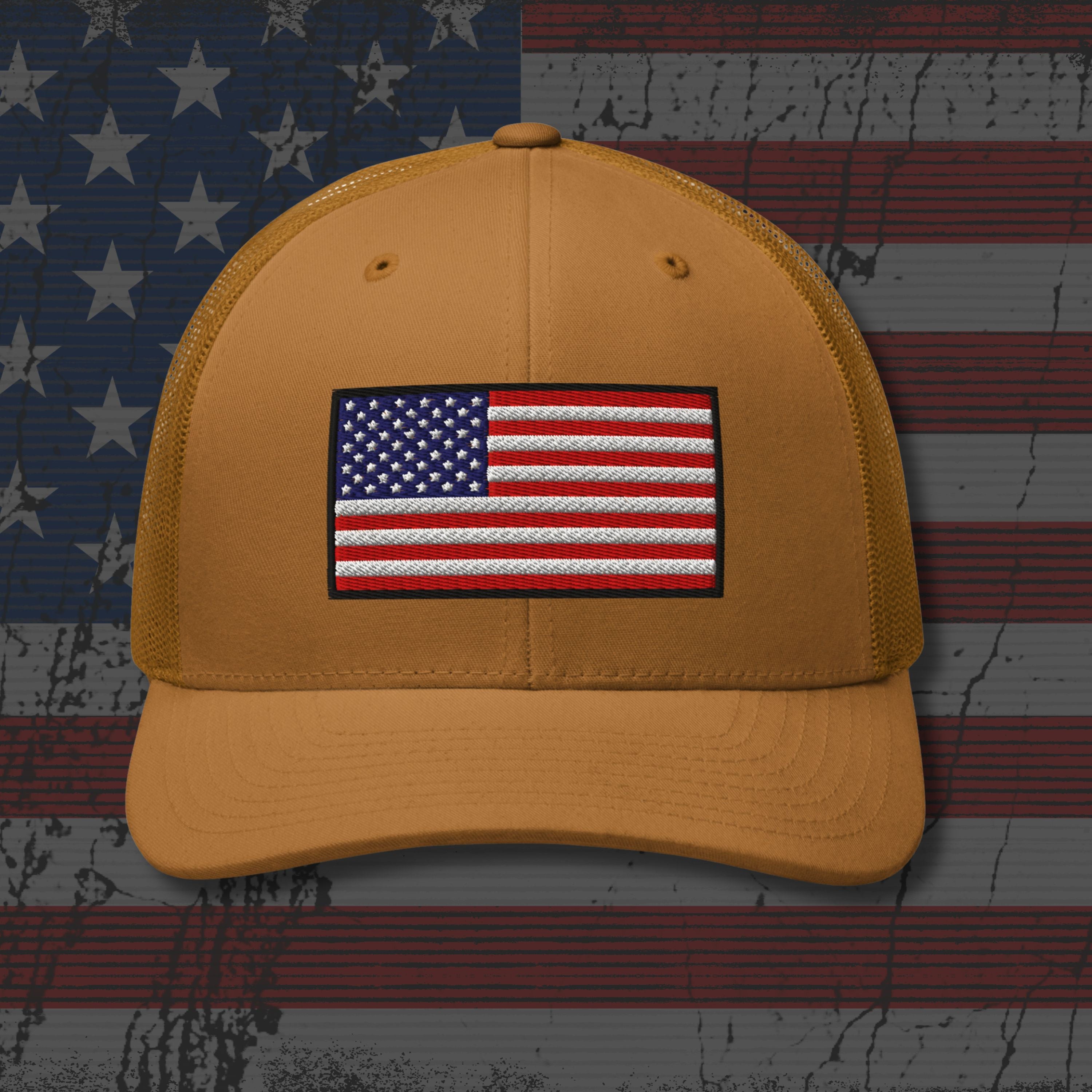 Yellow cap with American flag patch on a distressed American flag background
