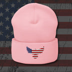 Pink beanie with an embroidered eagle design on a distressed American flag background
