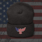 Dark gray beanie with an embroidered eagle design on a distressed American flag background