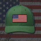 Green cap with American flag patch on a distressed American flag background