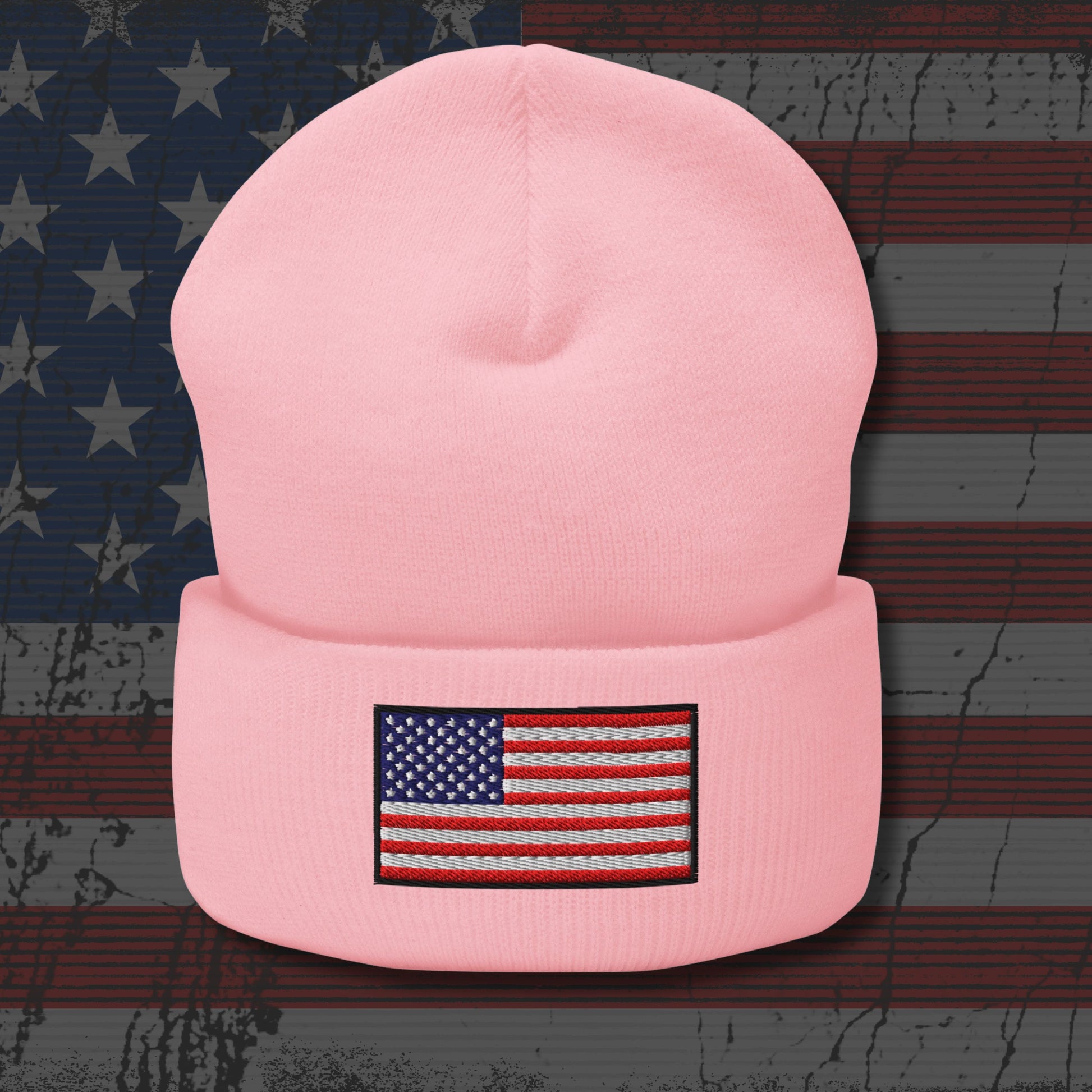 Pink beanie with American flag patch on a distressed American flag background