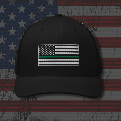 Black cap with a flag design on an American flag background