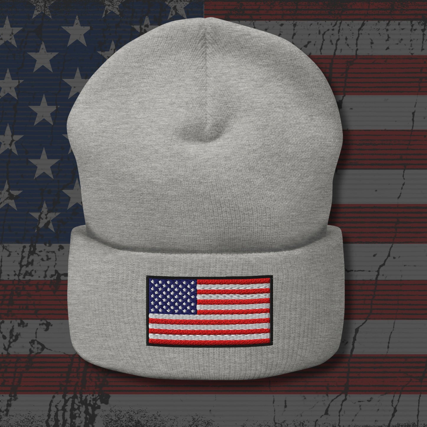 Gray beanie with American flag patch on a distressed American flag background