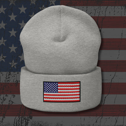 Gray beanie with American flag patch on a distressed American flag background