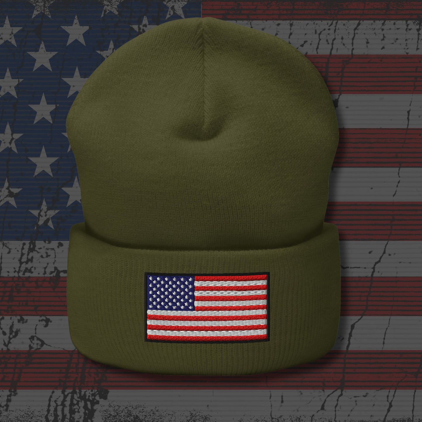 Green beanie with American flag patch on a background resembling an American flag.
